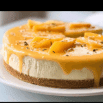 Mango Cheesecake Recipe: 1 Easy, Creamy No-Bake Delight 8 mango cheesecake recipe whole cake on table