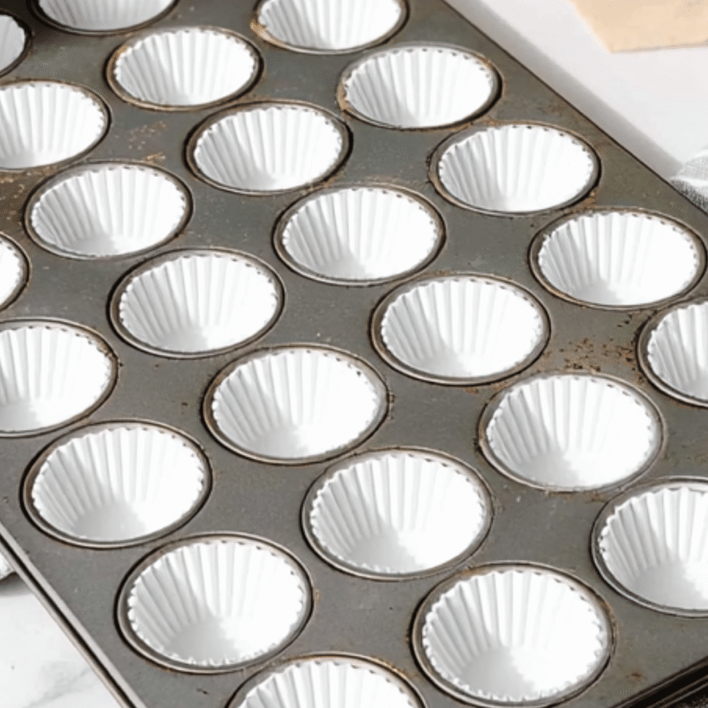 The Ultimate Guide to the Best Mini Chocolate Cupcakes: Moist, Fudgy, & Irresistible! 17 mini muffin pan lined with white paper cupcake liners for best mini chocolate cupcakes recipe