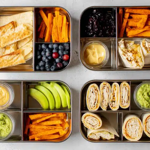 Top 5 Trending Protein Treats for School Lunches 2 Colorful bento lunch boxes filled with wraps, sweet potato fries, fruit, guacamole, and dips — a healthy variety of Protein Treats for School Lunches that are kid-friendly, high in protein, and easy to pack.