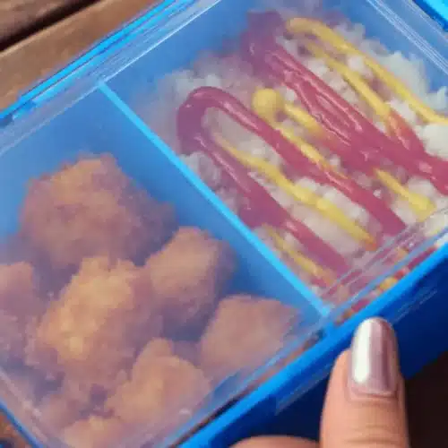 A vibrant blue lunchbox with savory snacks, perhaps followed by a delightful box cake mix with apple pie filling dessert.